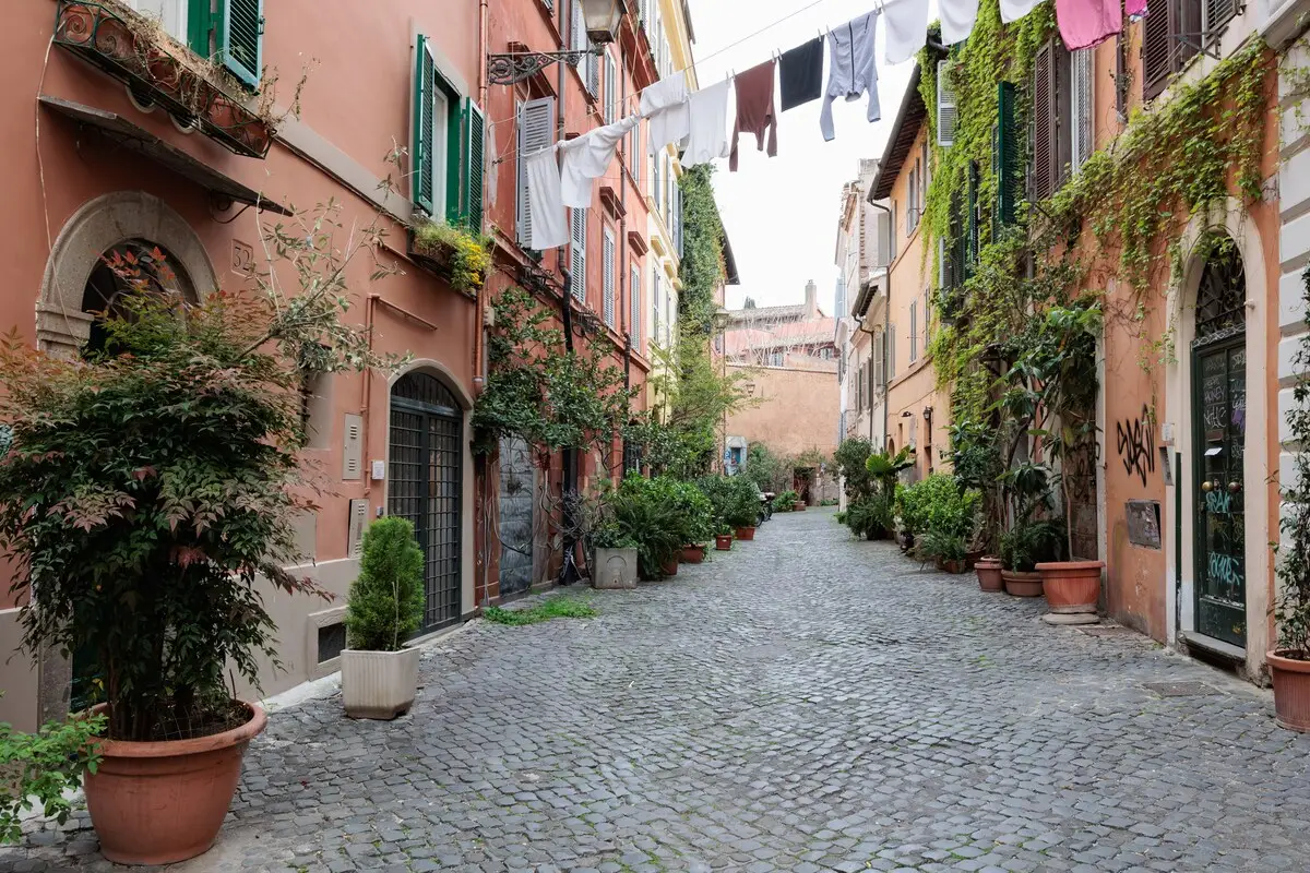 The lane outside the apartment, laundry strung between the façades.