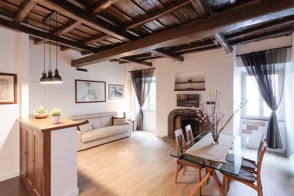 The living room from the entrance, under the beamed ceiling.