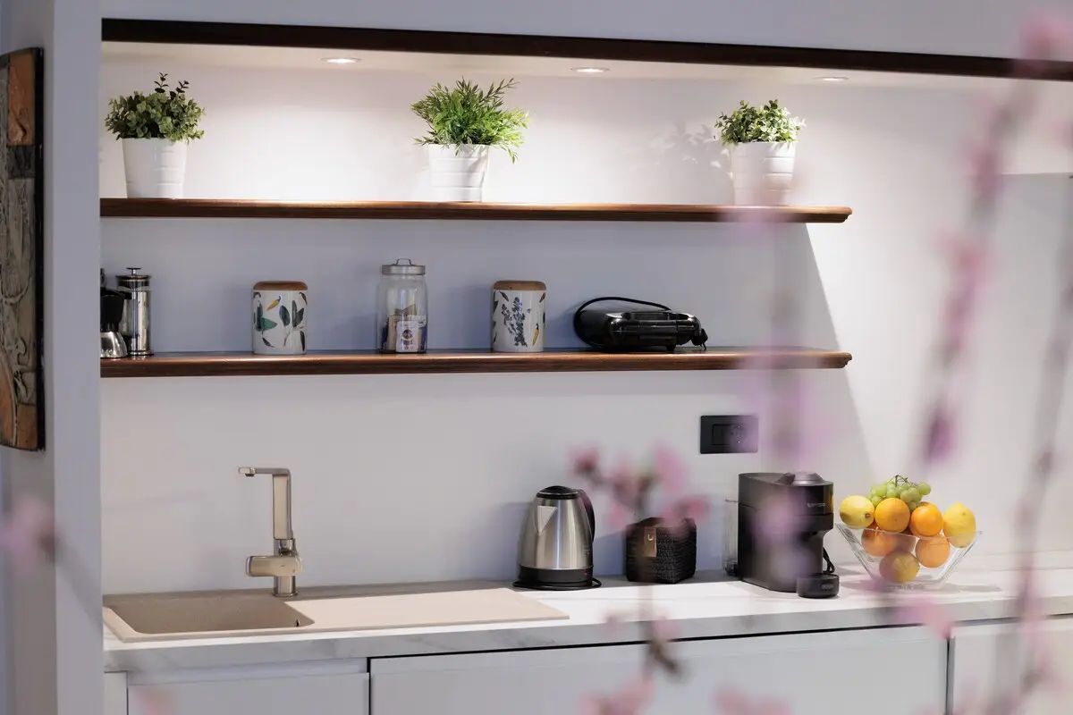 The kitchen worktop, with the kettle and a bowl of citrus.